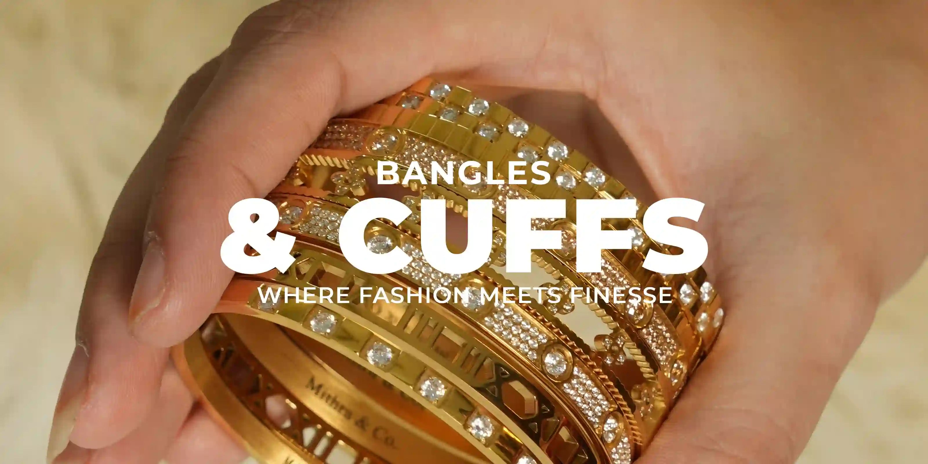 woman wearing 18k Gold Plated Bangles and Cuffs holding gold stone-studded bangles