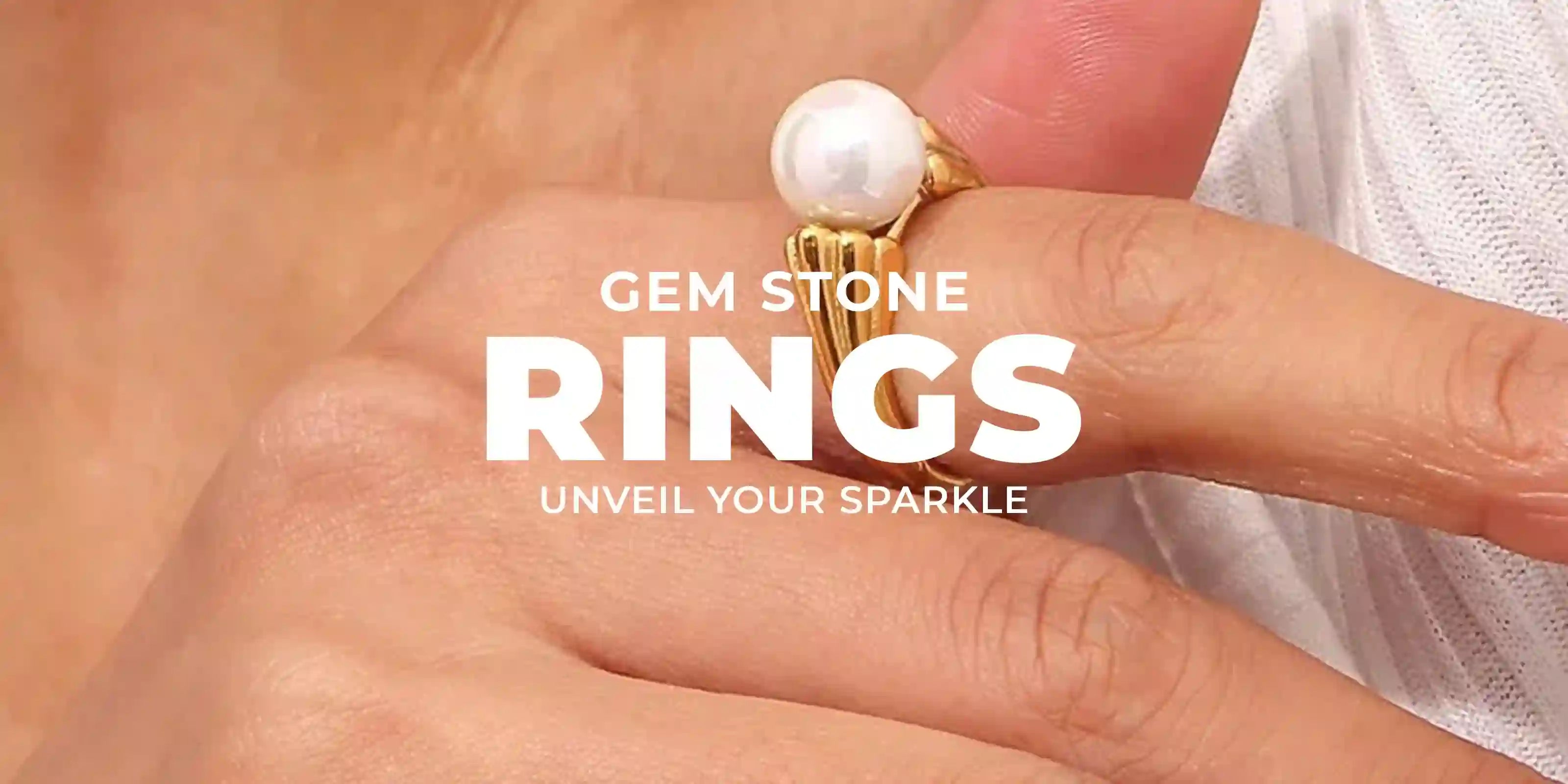 Text Gem Stone Rings and a hand wearing a mystic gold plated ring in index finger. crafted with divine energy