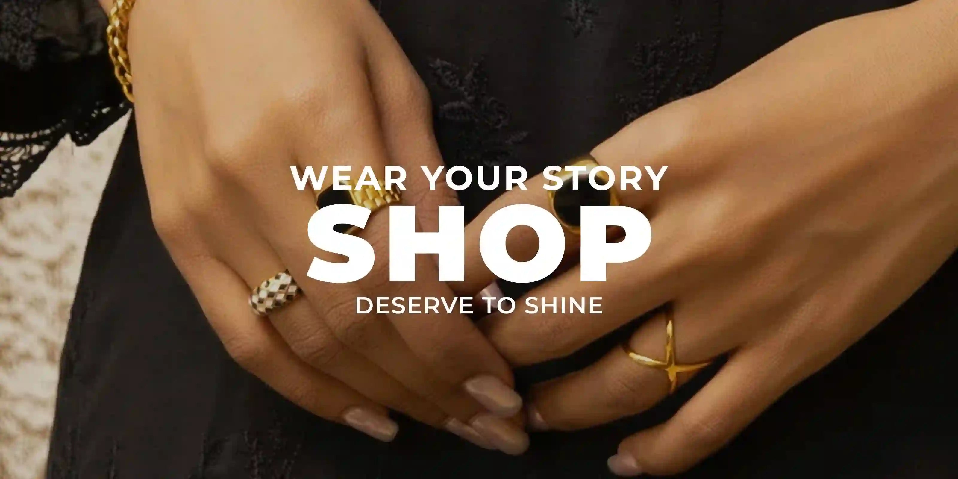 woman wearing 18k Gold Plated rings on fingers with black lace sleeve background