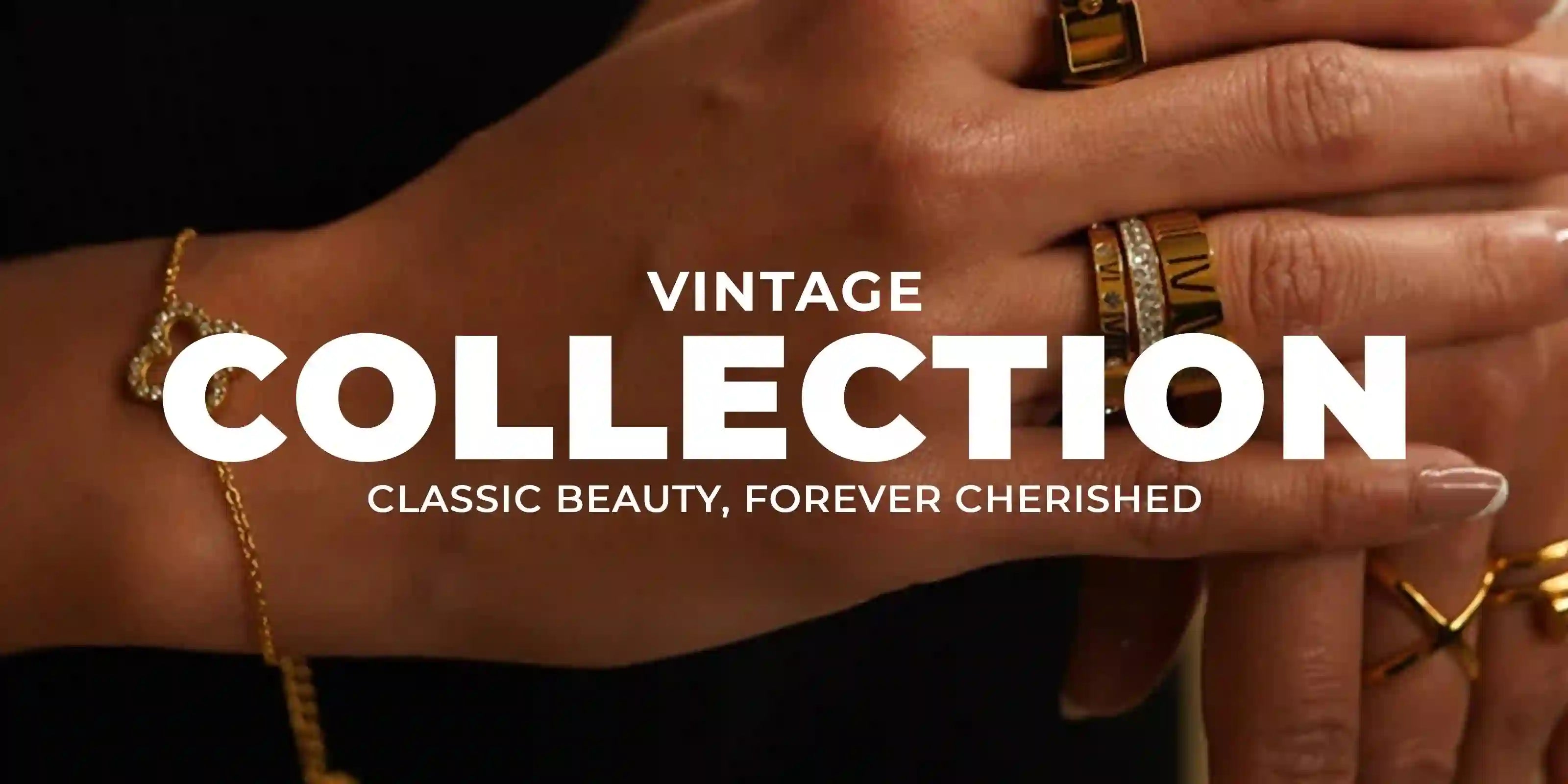 Close-up of hand wearing vintage collection 18k gold plated rings and bracelet jewelry