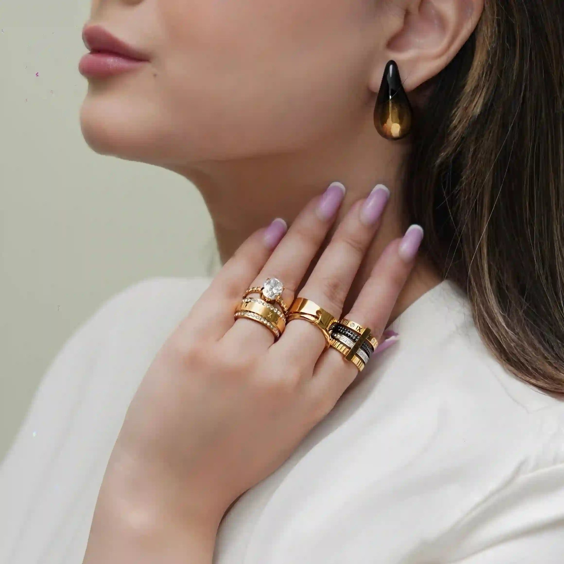 GIrl Wearing Black and Gold Drop Earrings - Avant Garde. Buy at Mithra and Co.