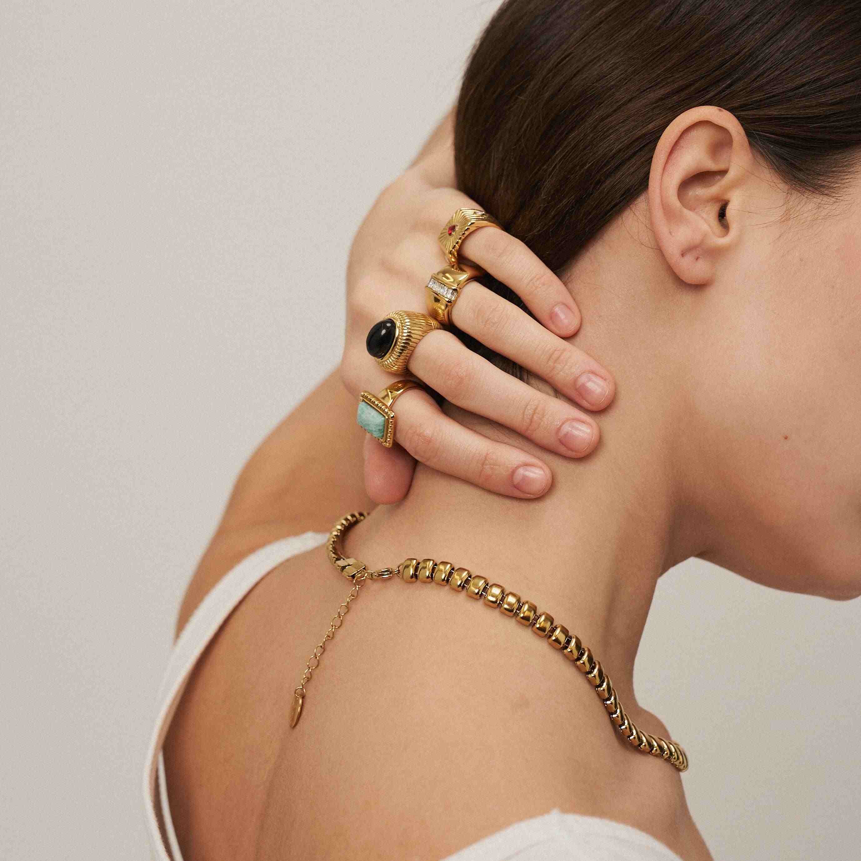 Girl wearing 18k Gold Plated artificial Jewelry. Buy Online at Mithra and Co.