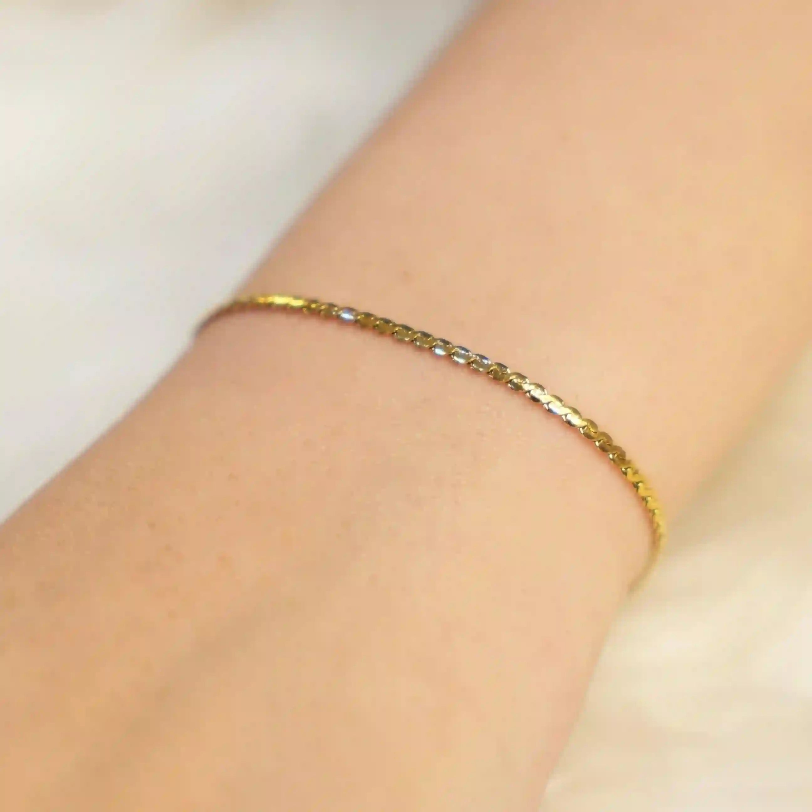 Wearing 18k Gold Plated thin S Chain Bracelet - Cici. Buy Online at Mithra and Co.