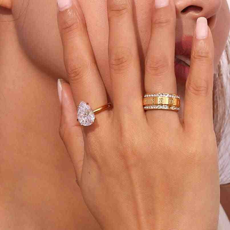 Girl wearing 18k gold plated rings. Shop at Mithra and Co.