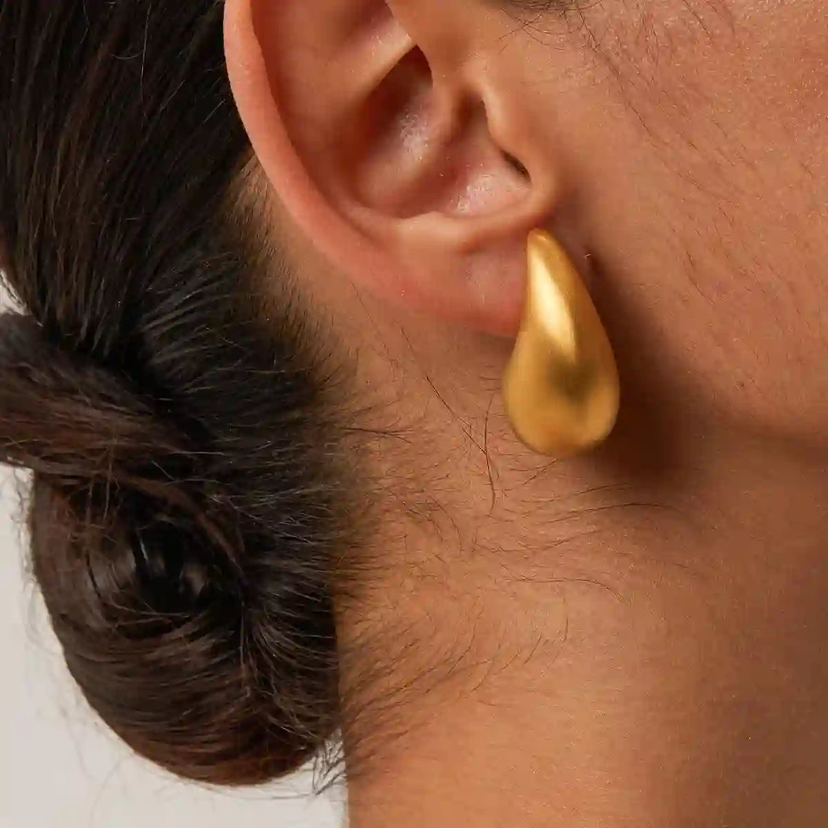 GIrl wearing Gold Plated Teardrop Earrings - Horis Matte. Shop online at Mithra and Co.