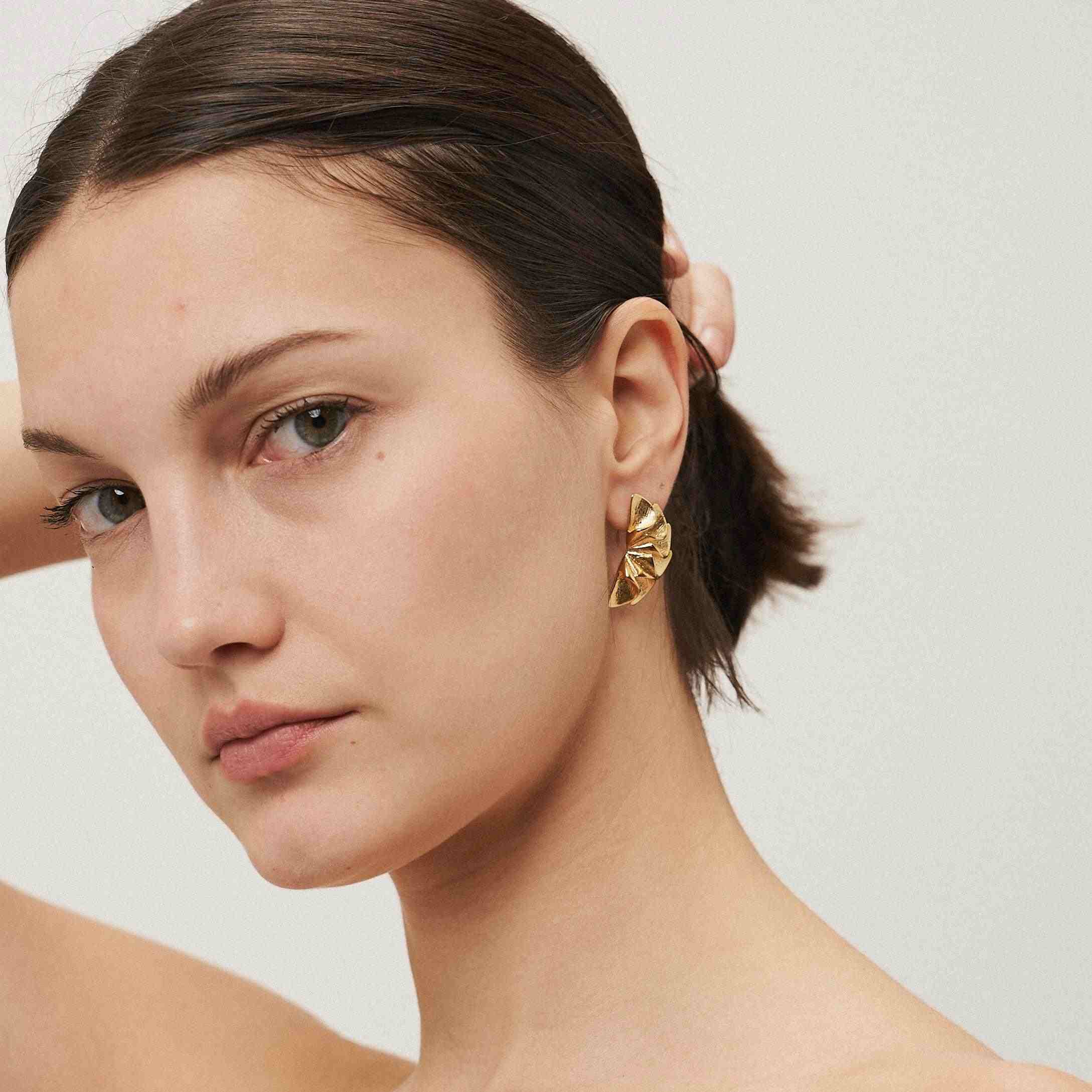 Girl wearing Flora Earrings - 18k Gold Plated Flower Earrings. Buy Now.