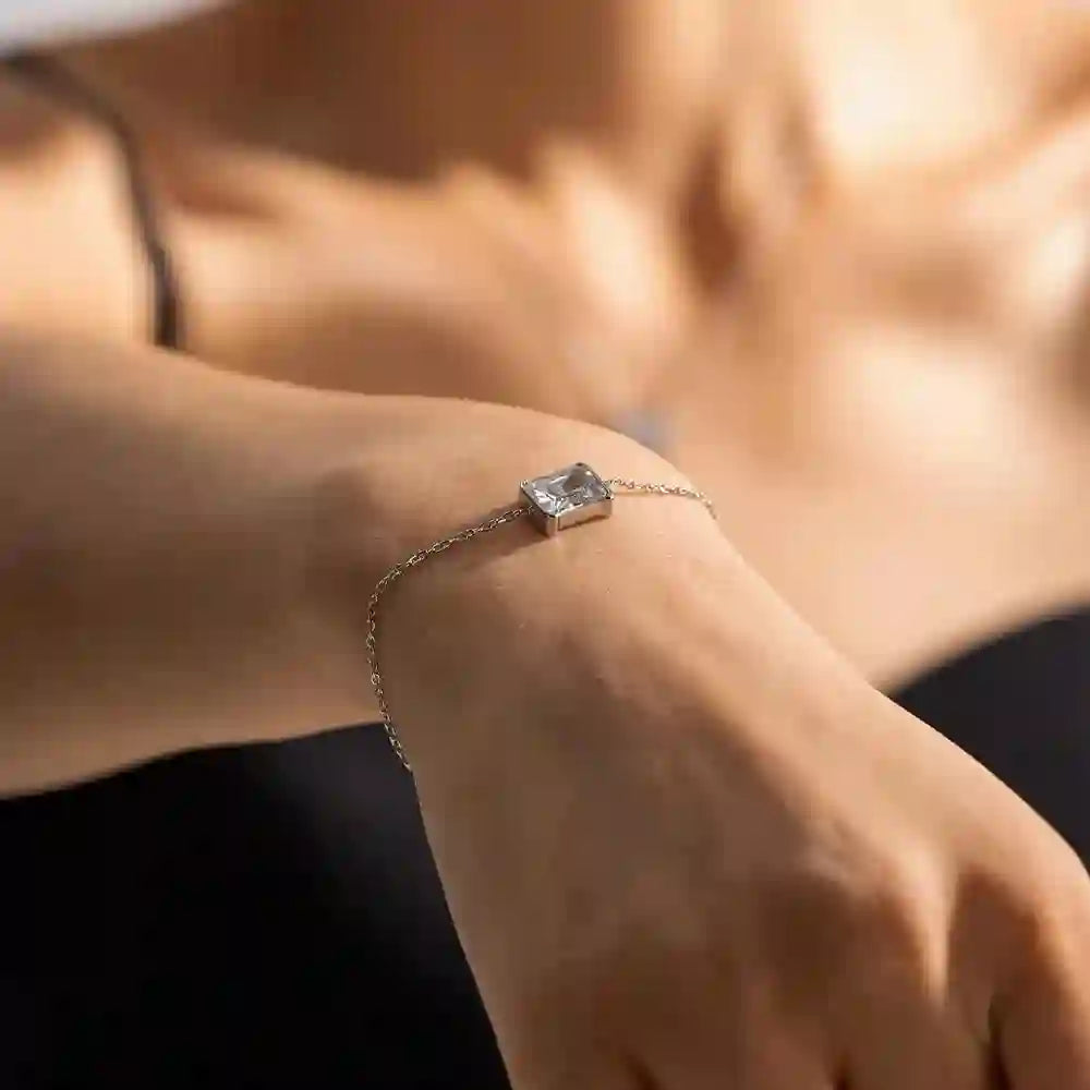 Girl wearing Silva. A SIlver Chain Bracelet with square stone. Buy at Mithra and Co.