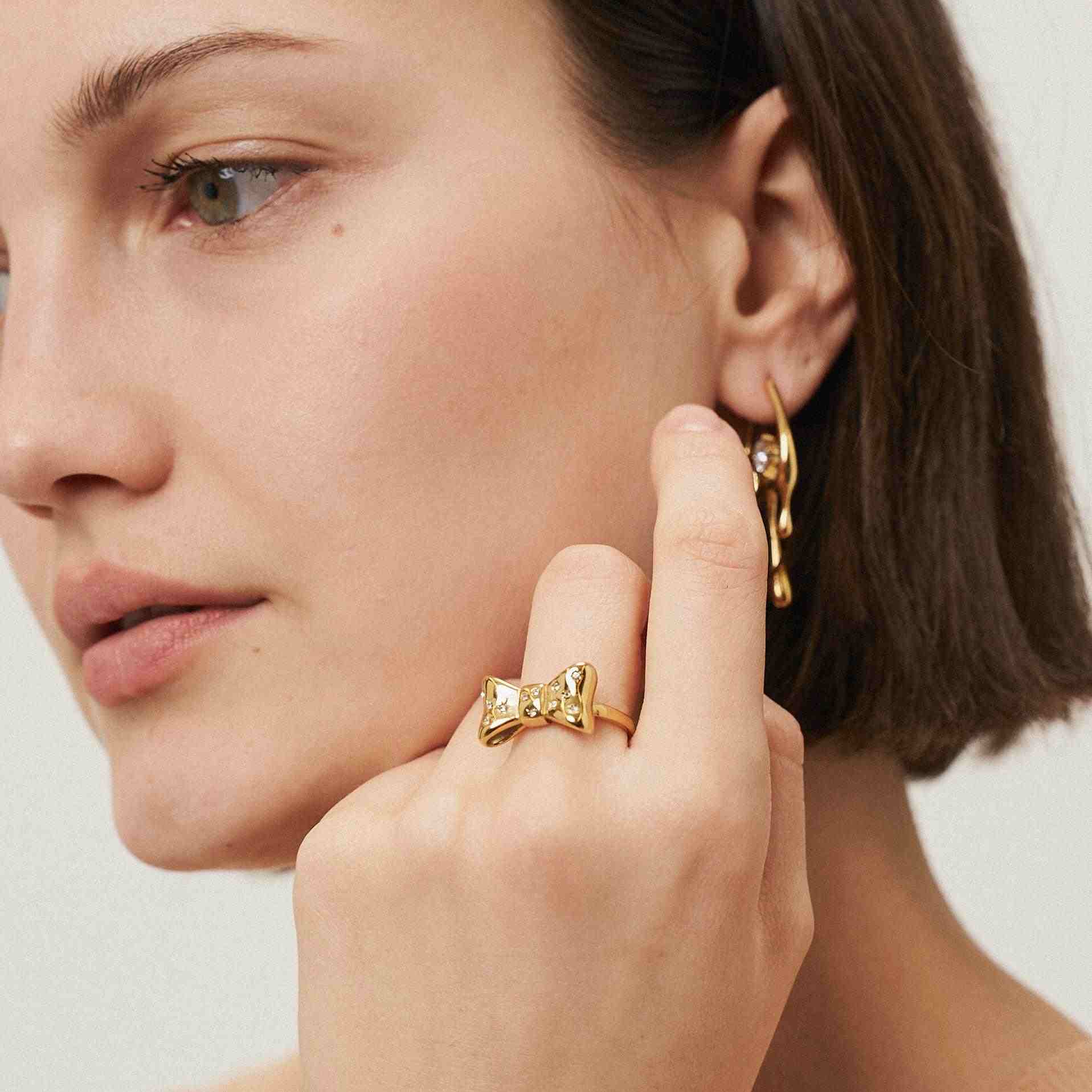 Girl wearing Gold Plated Ring and Earring. Shop Online in Pakistan.