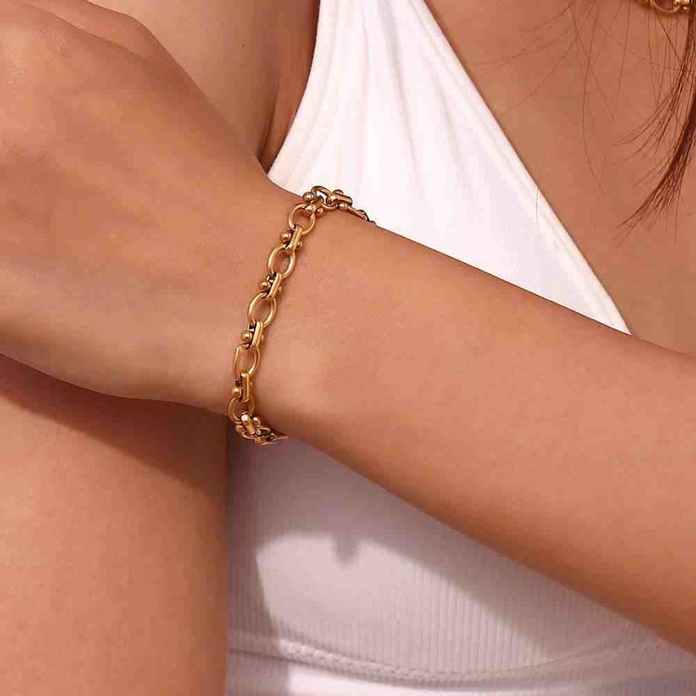 Wearing 18k Gold Plated Bracelet on wrist. Buy Online at Mithra and Co.