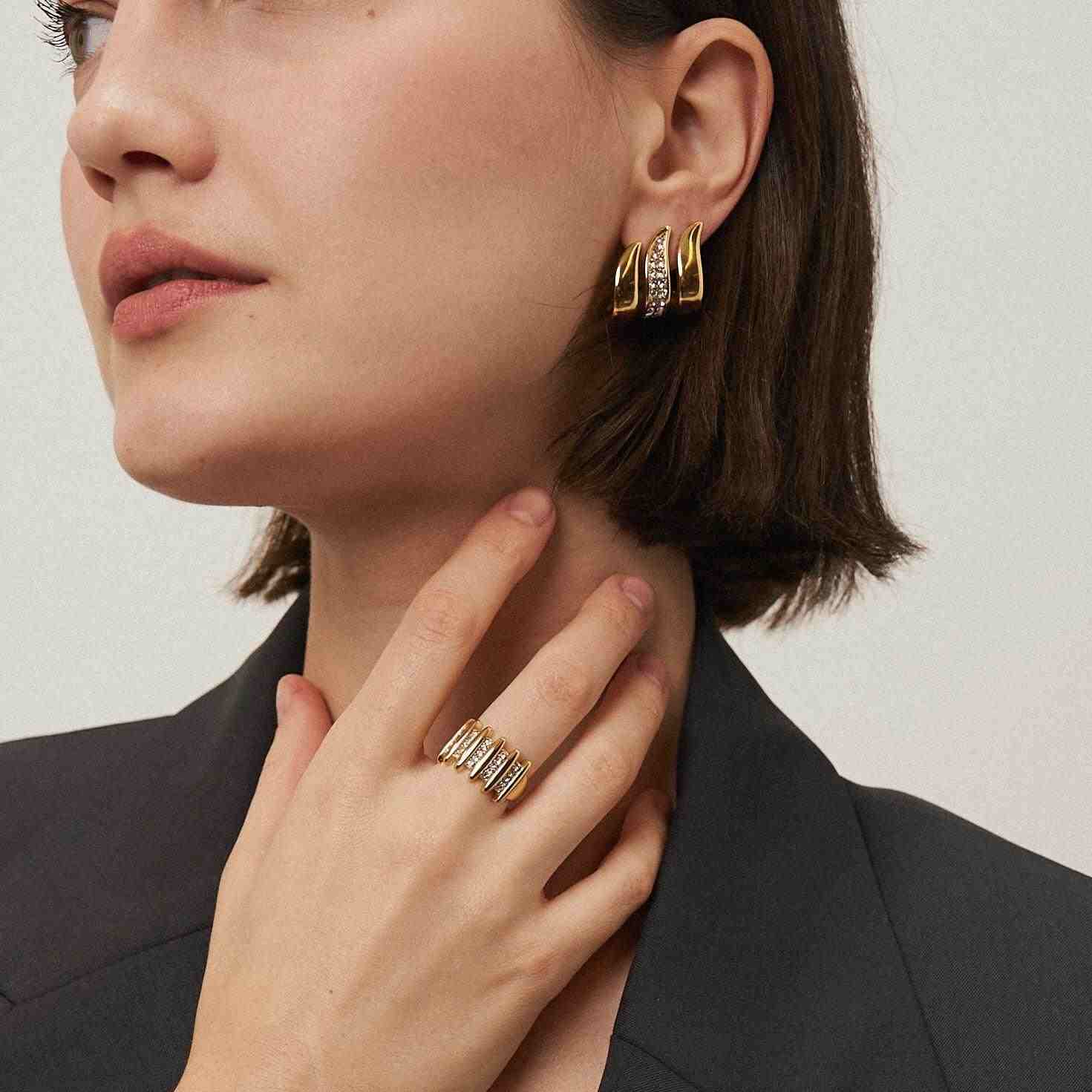 Wearing Gold Plated Earrings. Shop at Mithra and Co.