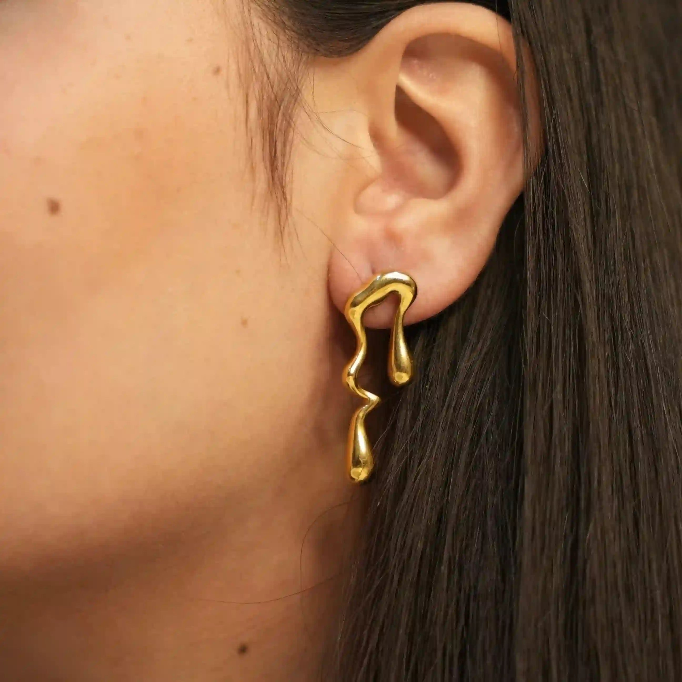 Wearing 18k gold plated Liquid earrings. Shop waterdrop earrings Online at Mithra and Co.