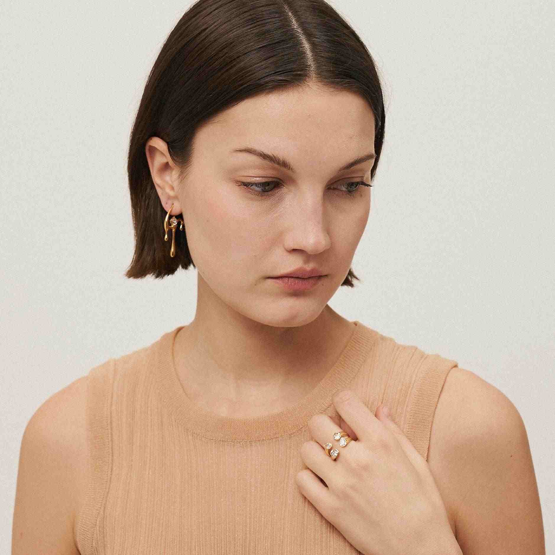GIrl Wearing Gold Plated ring and earring. Shop Now.