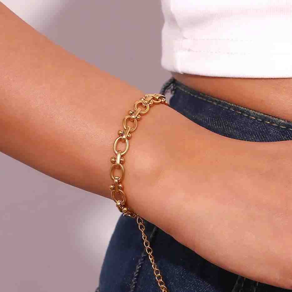 Wearing 18k Gold Plated Chain Bracelet - Delulu on wrist. Buy Now at Mithra and Co.