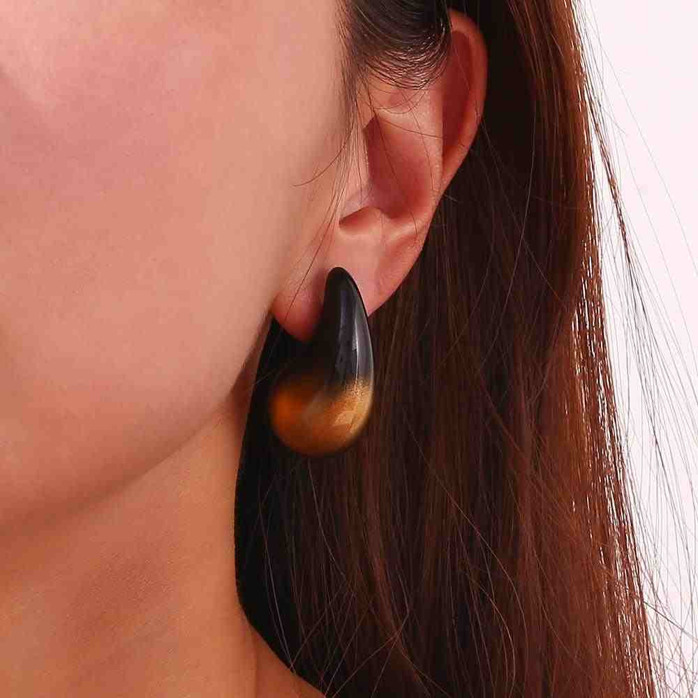 Girl wearing Black and Gold Drop Earrings - Avant Garde. Shop at Mithra and Co.