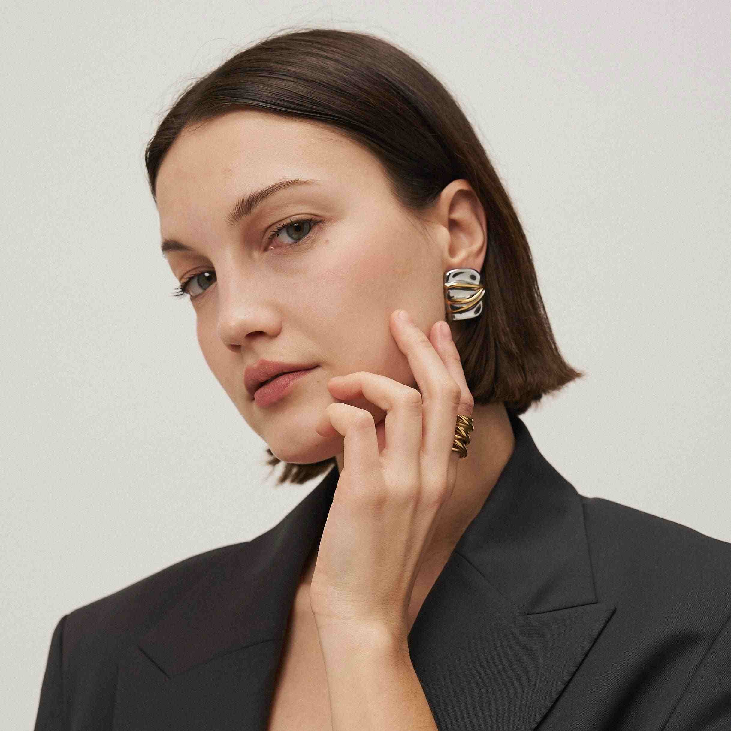 Wearing 18k Gold Plated Solara Ring. Shop Crossover Ring Online at Mithra and Co.