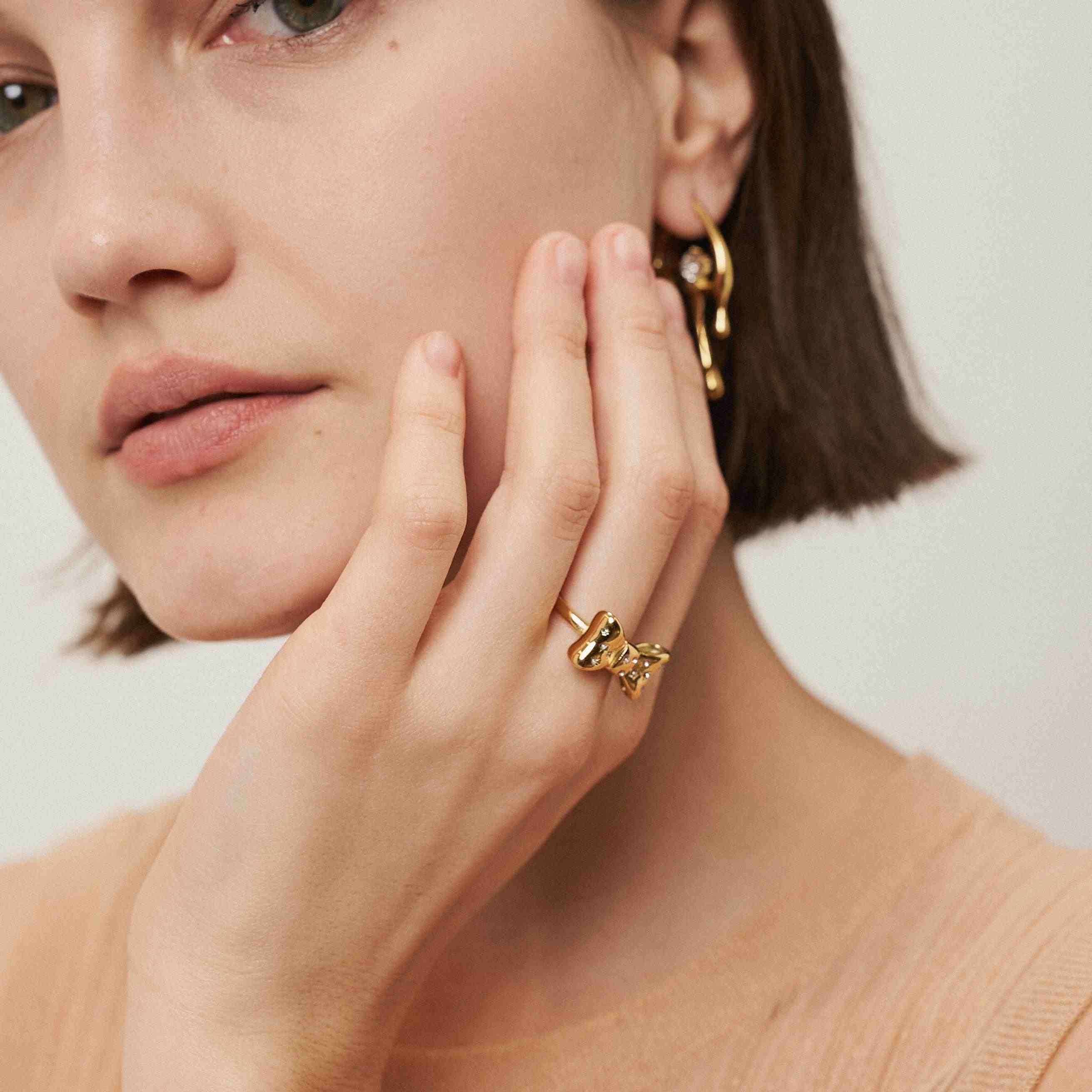 Girl wearing Gold Plated Ring and Earring. Buy Online Pakistan.