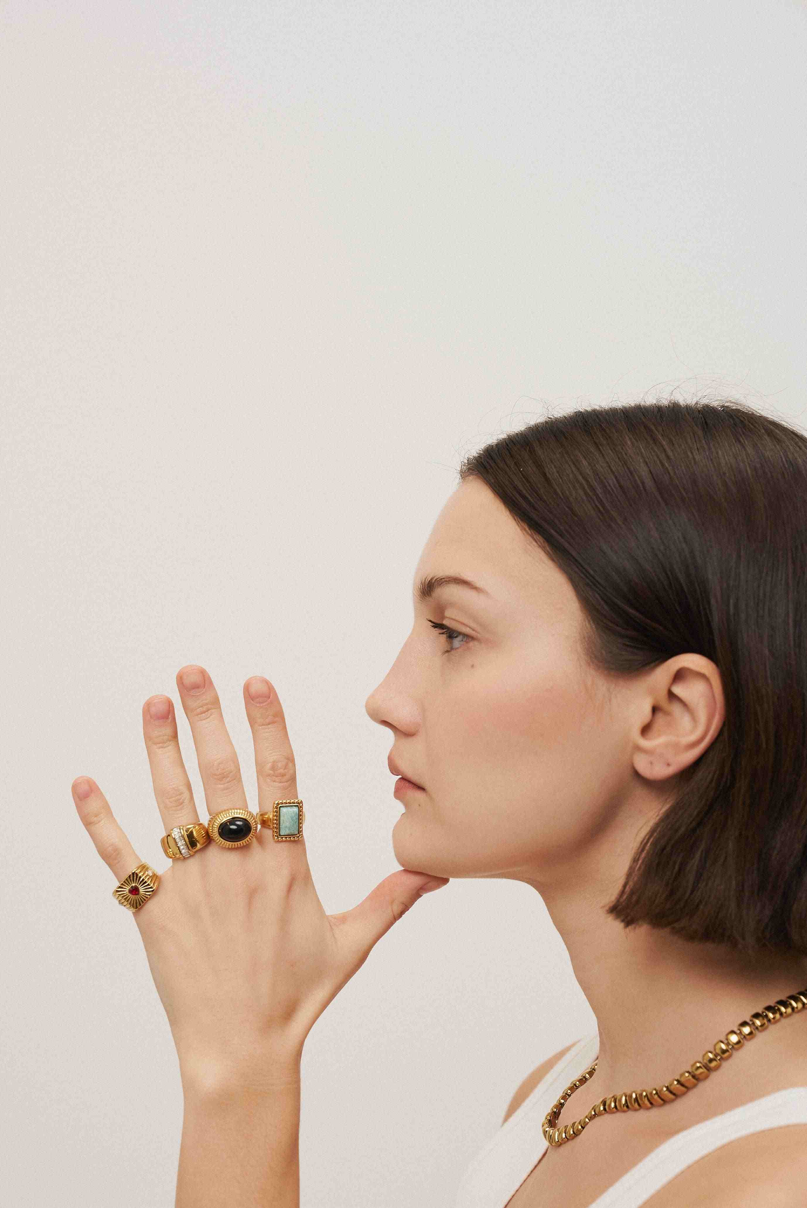 Girl wearing Rings 18k gold plated. Buy Online at Mithra and Co.