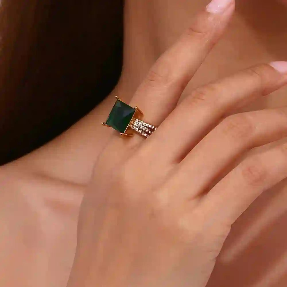Girl wearing Green Gemstone Ring in Index finger.