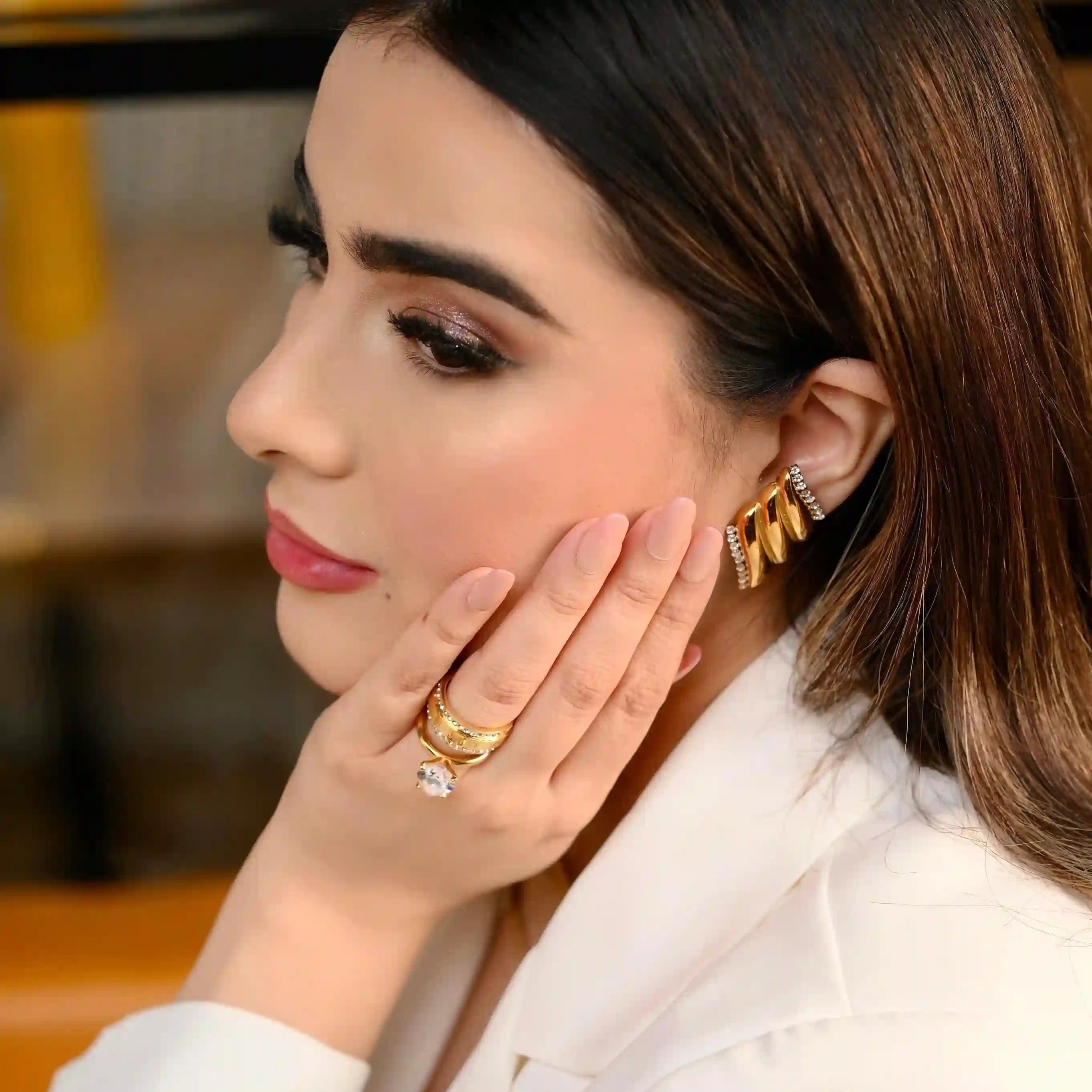 Girl wearing 18k Gold Plated Jewelry. Shop at Mithra and Co.