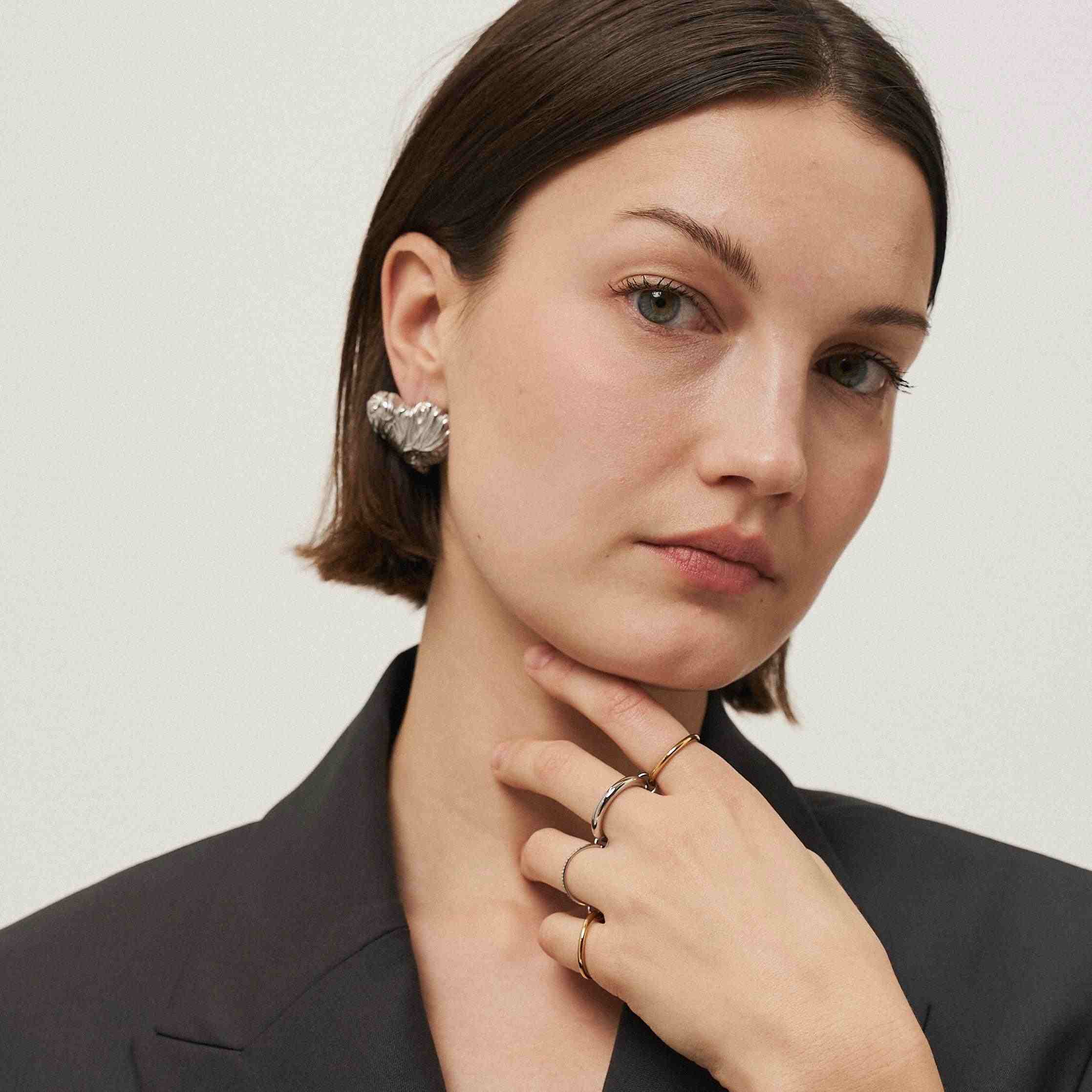 Girl wearing 18k Gold Plated stud earrings. Shop Online at Mithra and Co.