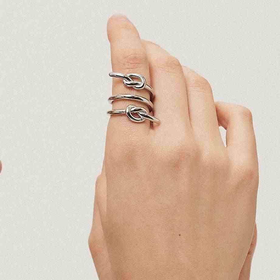 Girl Wearing SIlver Plated 3 Layer Spiral Ring With Knot. Buy Online at Mithra and Co.