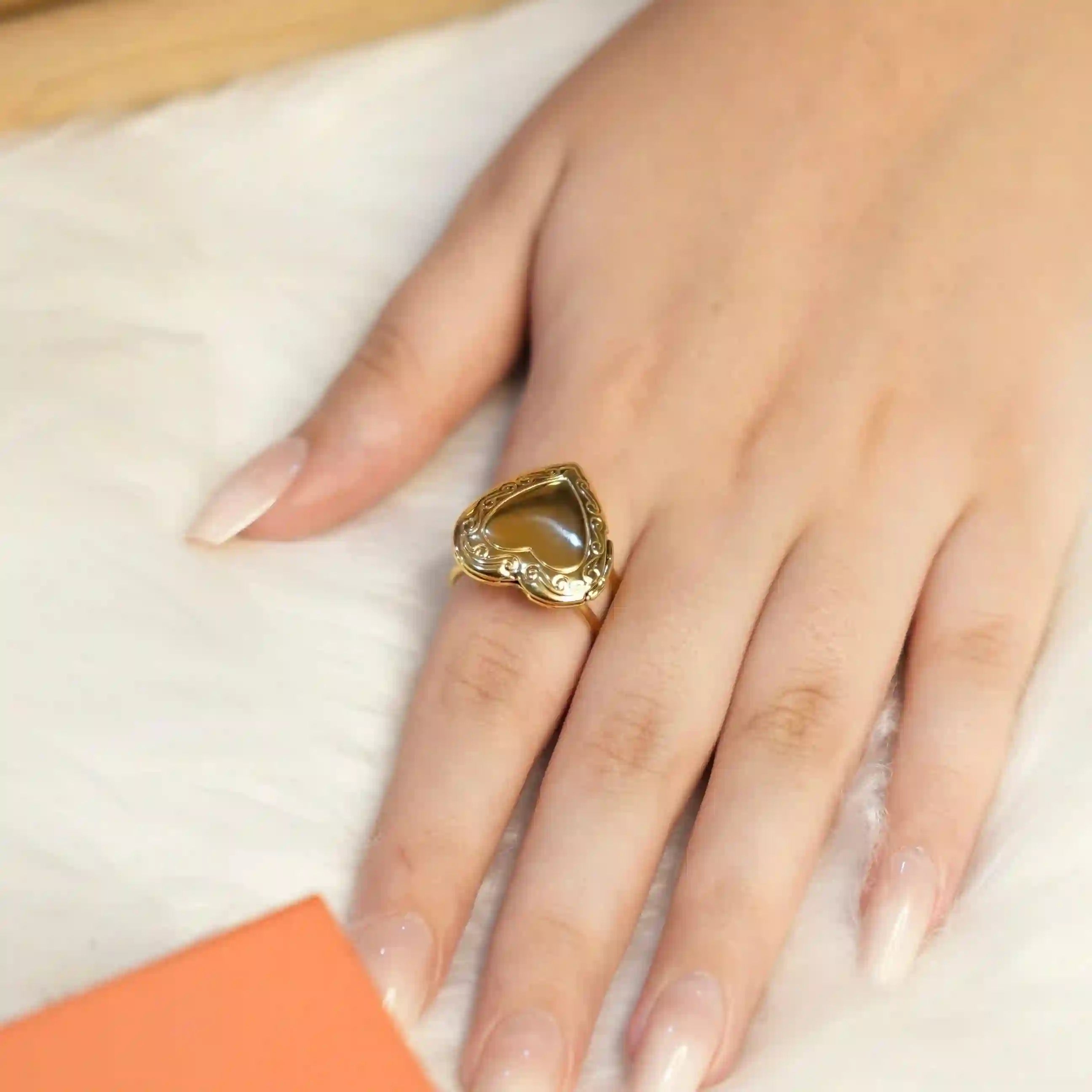 Wearing Heartfelt Memories Ring. Buy 18k Gold Plated heart shape locket ring at Mithra and Co.
