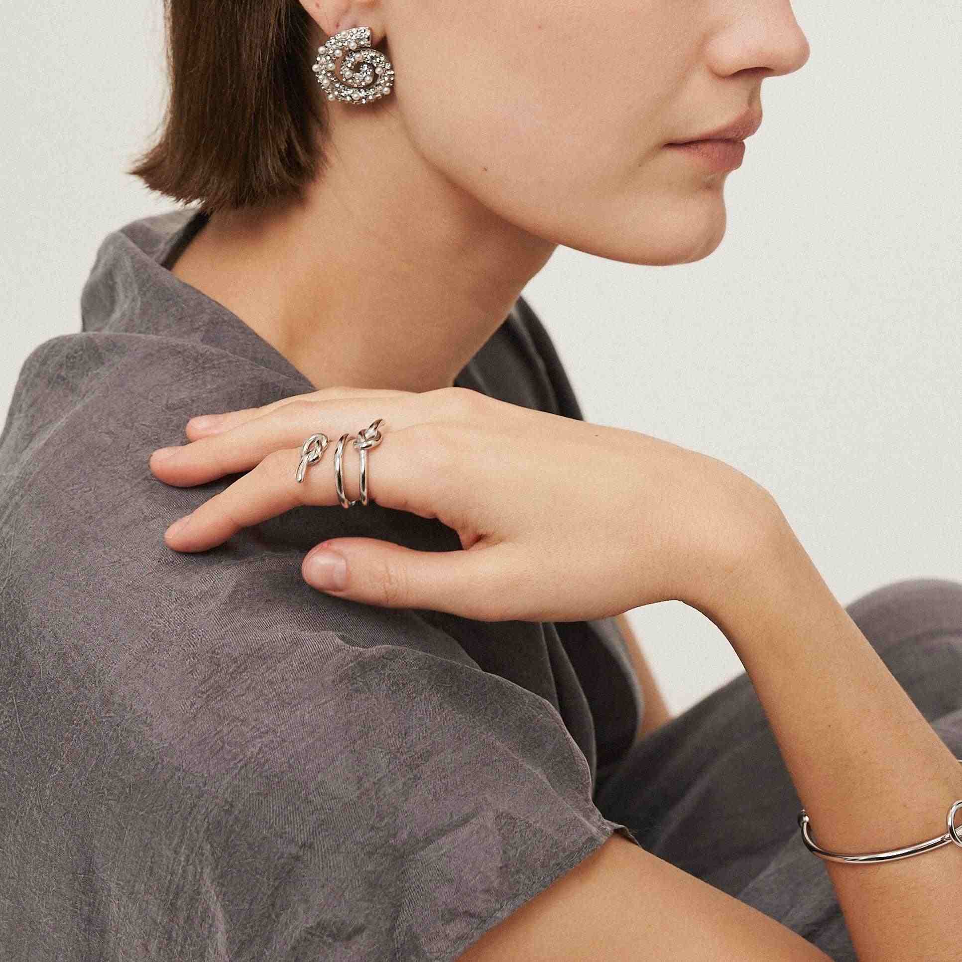 Girl Wearing Ring and Earring gold plated. Buy Now at Mithra and Co.