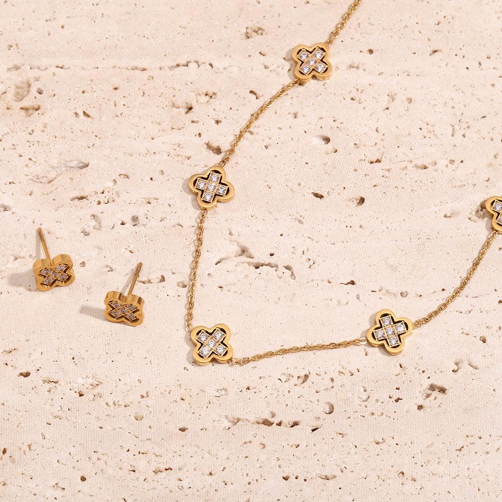 18k Gold Plated Clover necklace and clover studs. Shop at Mithra and Co.
