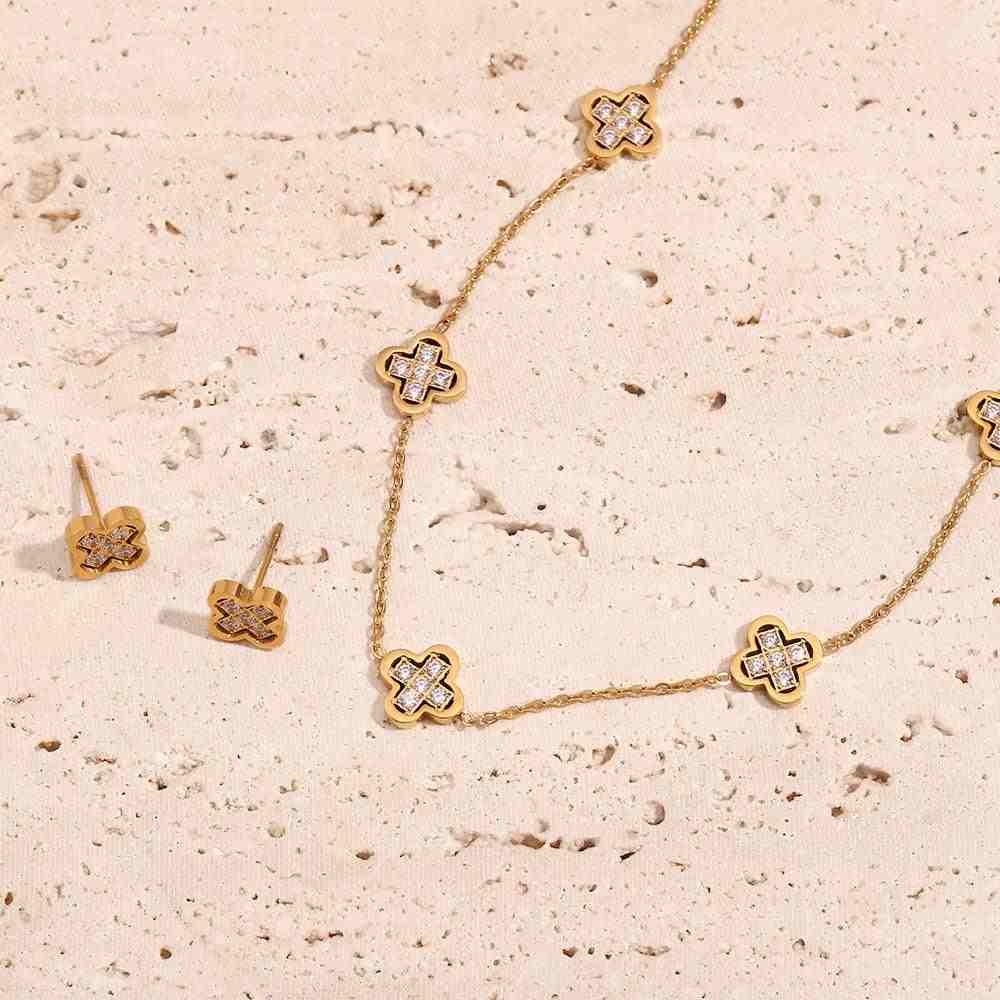18k Gold Plated Clover necklace and clover studs. Shop at Mithra and Co.