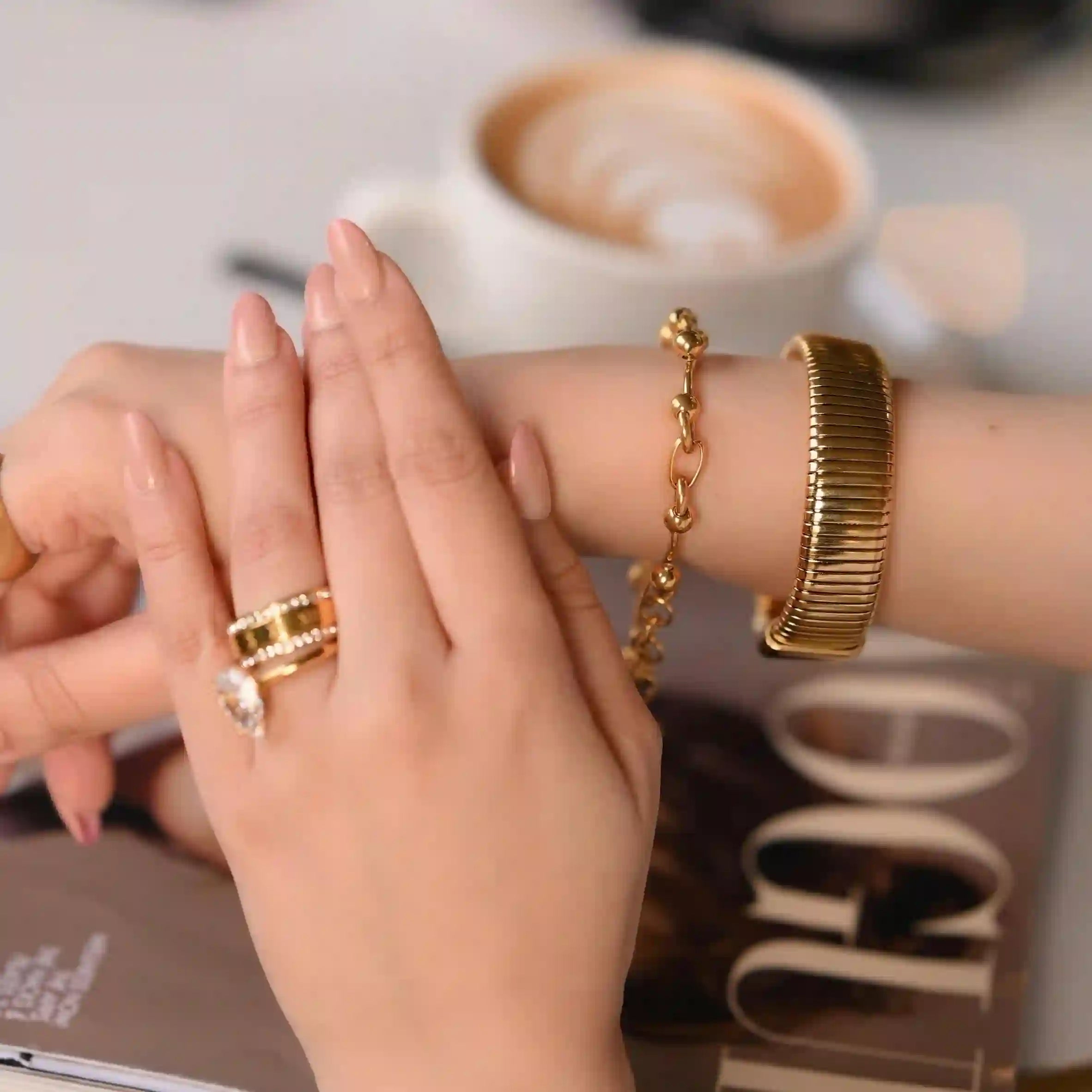 Girl Wearing Waterproof 18k Gold Plated Bracelets. Shop at Mithra and Co.