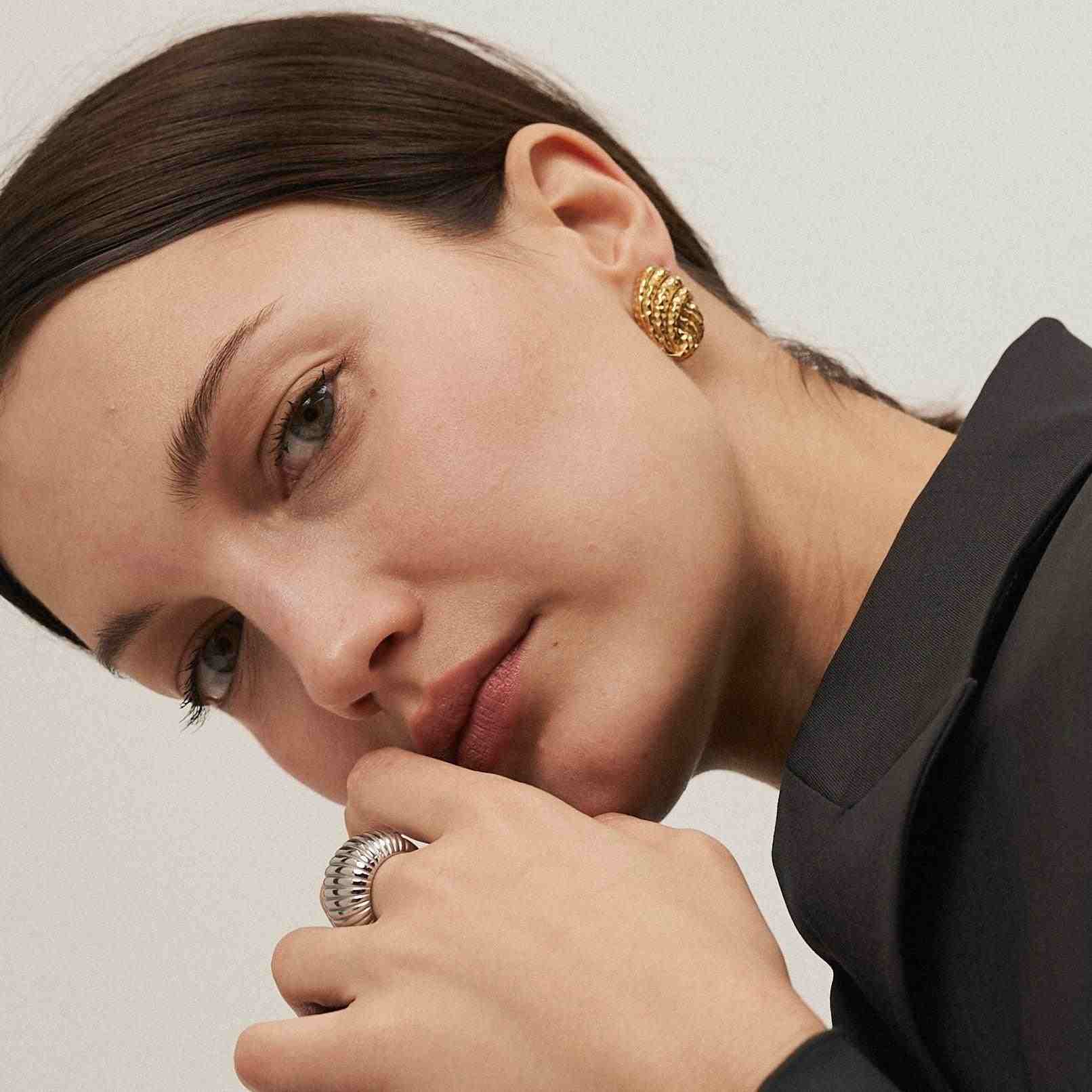 Girl wearing Gold Plated Studs. Buy Online at Mithra and Co.