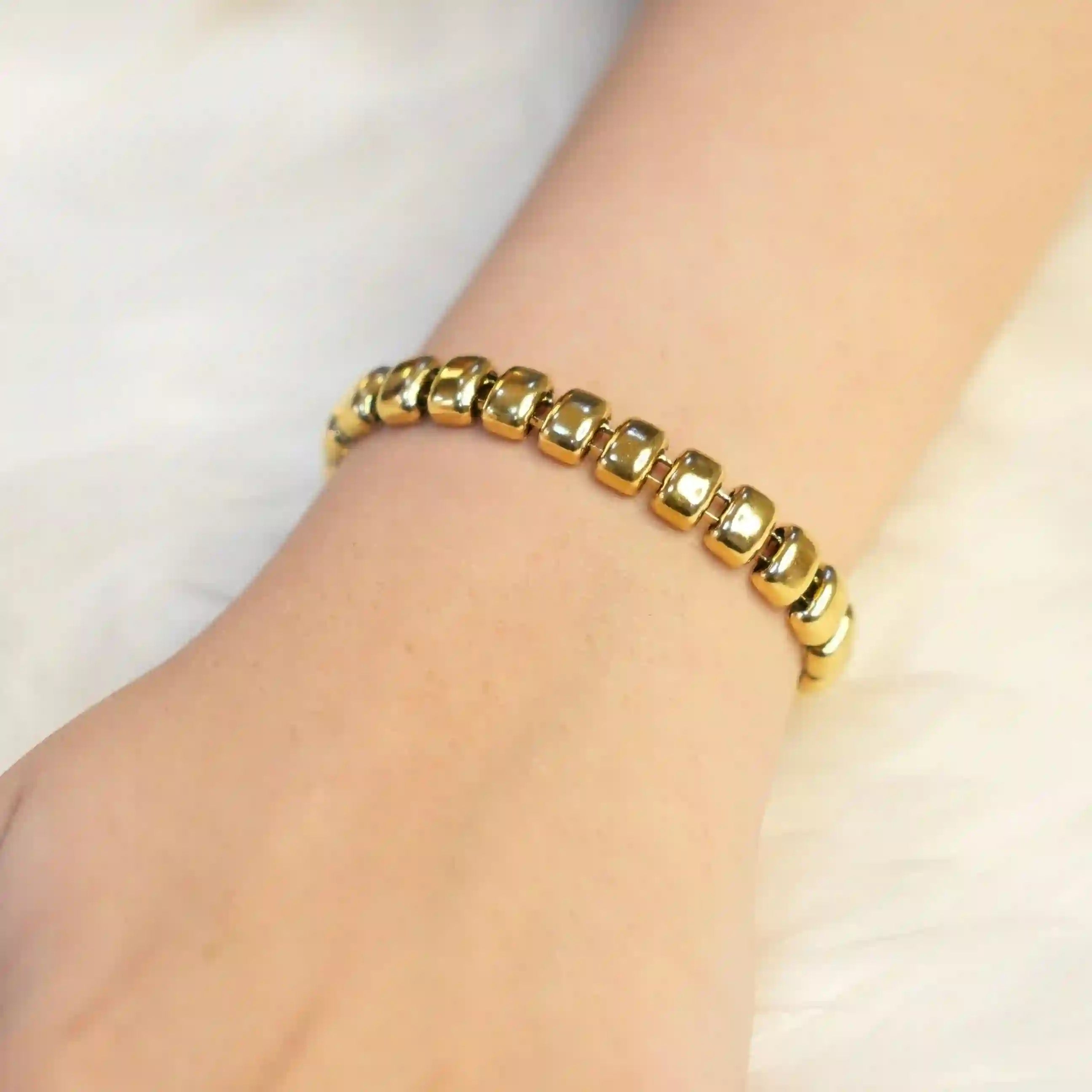 Girl wearing Baroque Bracelet. 18k Gold Plated Tasbih Beads bracelet Shop at Mithra and Co.