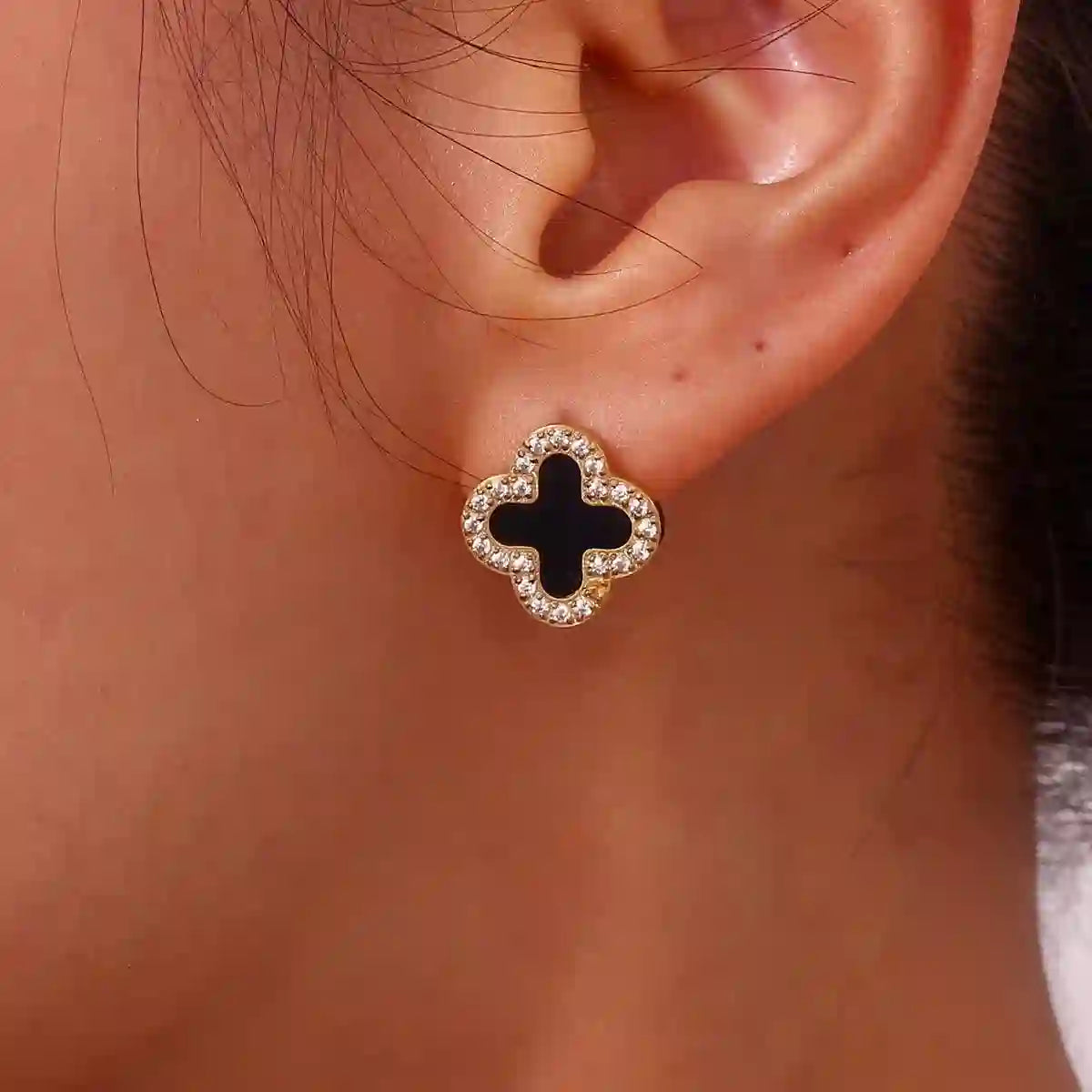 girl wearing midnight clover stud in left ear. shop in Pakistan at Mithra and Co.