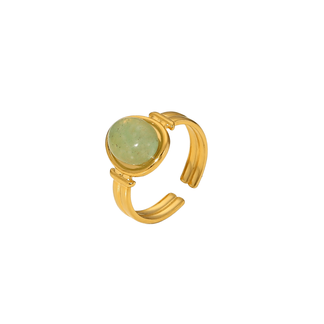 18k Gold Plated ring with round green gemstone on a white background
