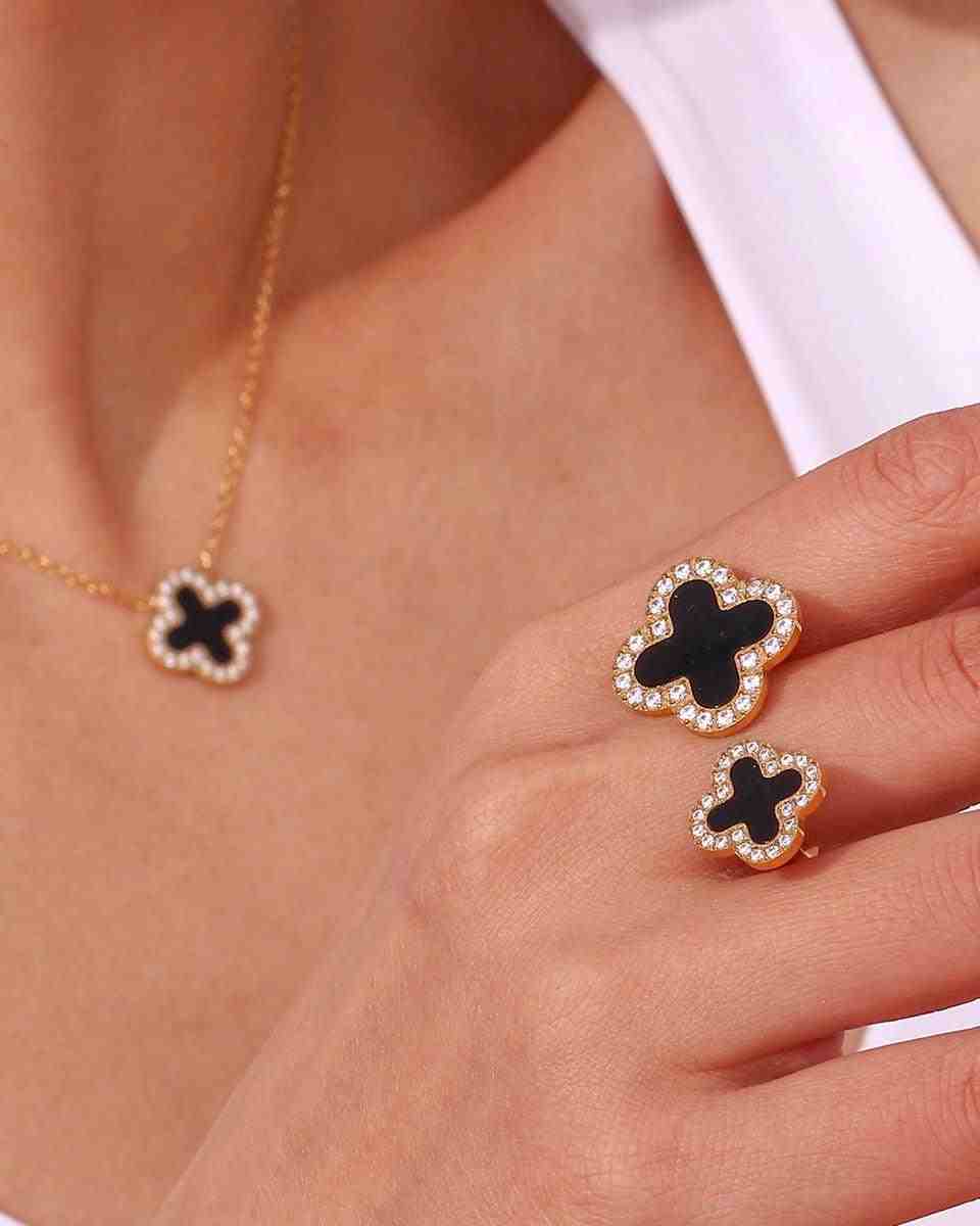 Girl wearing Midnight clover flower ring. Shop 18k Gold Plated at Mithra and Co.
