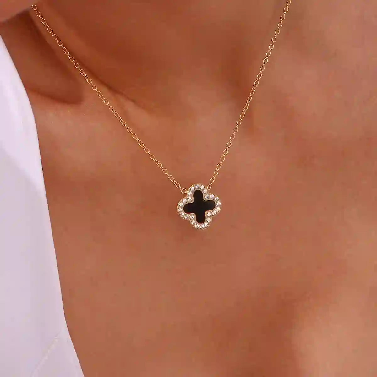 Clover Necklace 18k Gold plated with Zircons around and black stone in center. Shop Online.