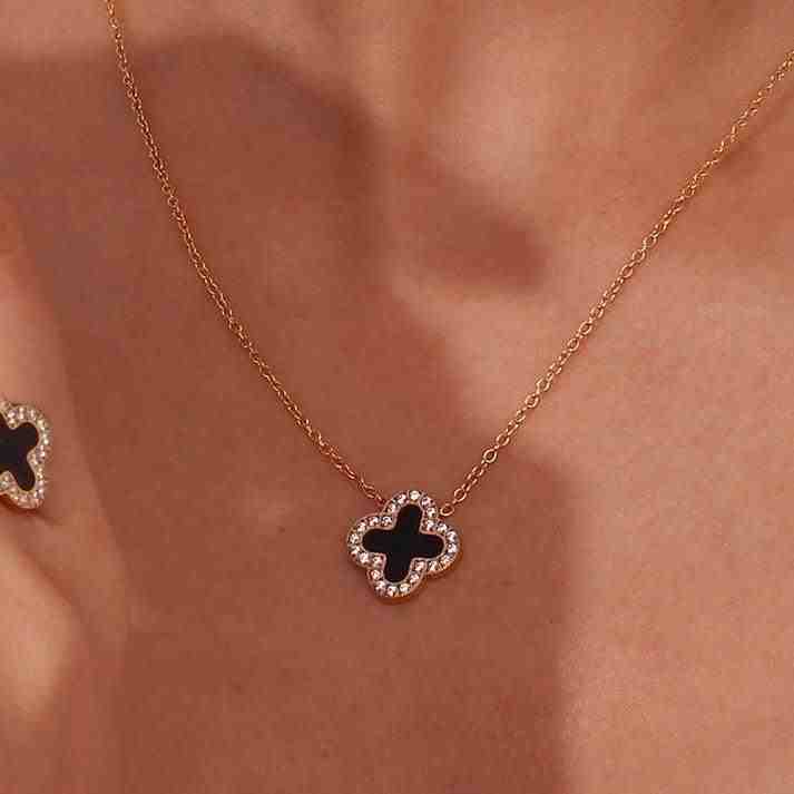 18k Gold plated Clover Necklace. Zircons around and black stone in center. Shop at Mithra and Co.