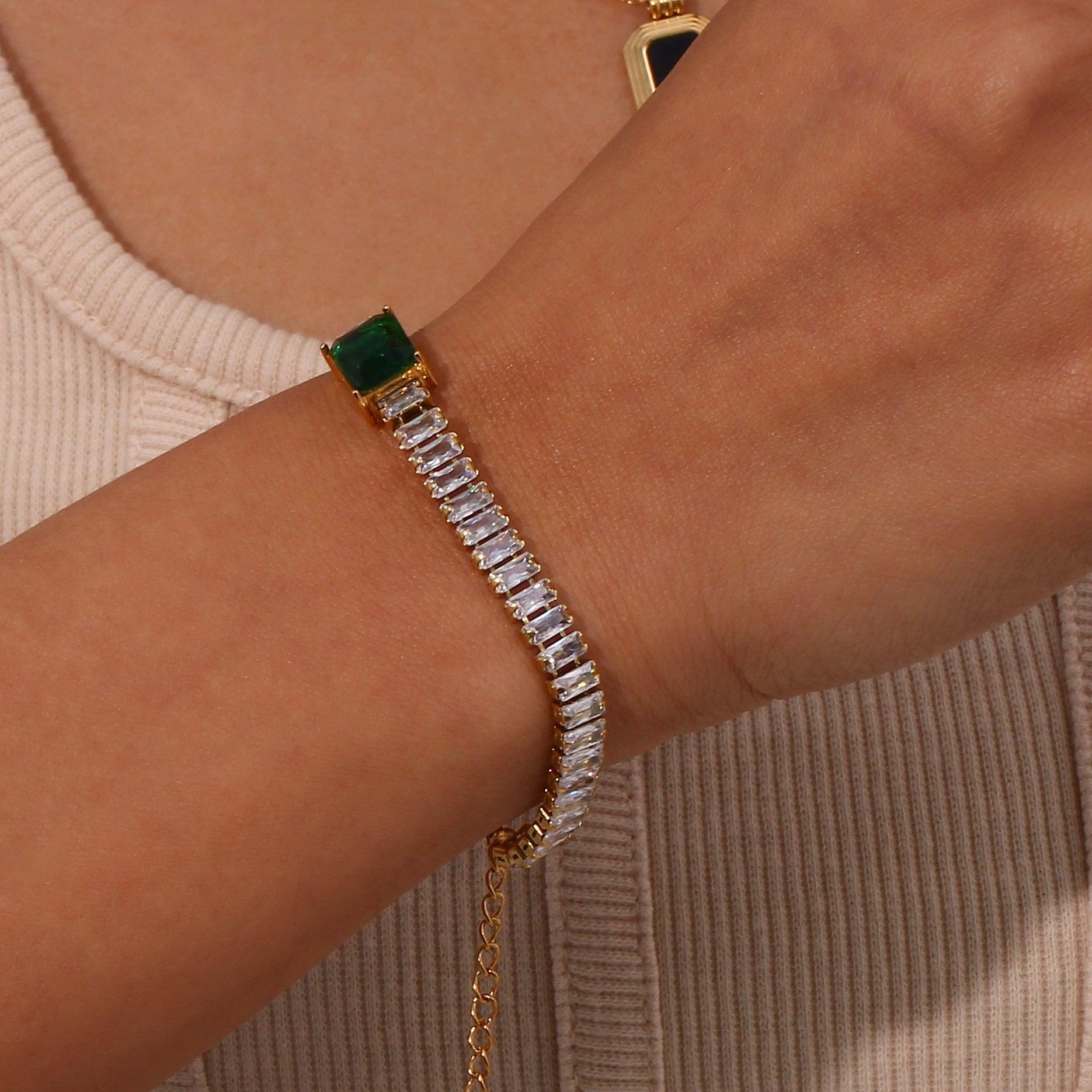 girl wearing emerald bracelet solo in right hand. 18k gold plated.