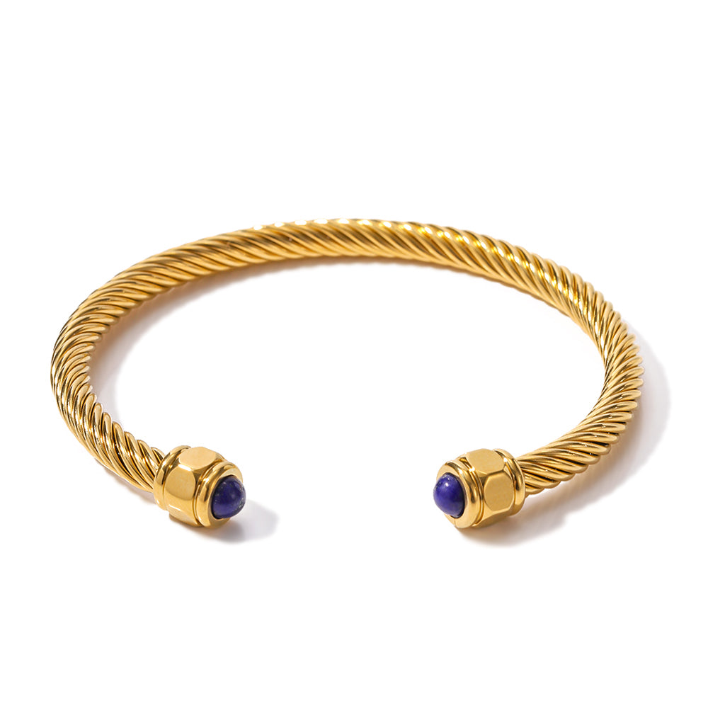 Shop The Kora Bangle inspired by the David Yurman cable bracelet.